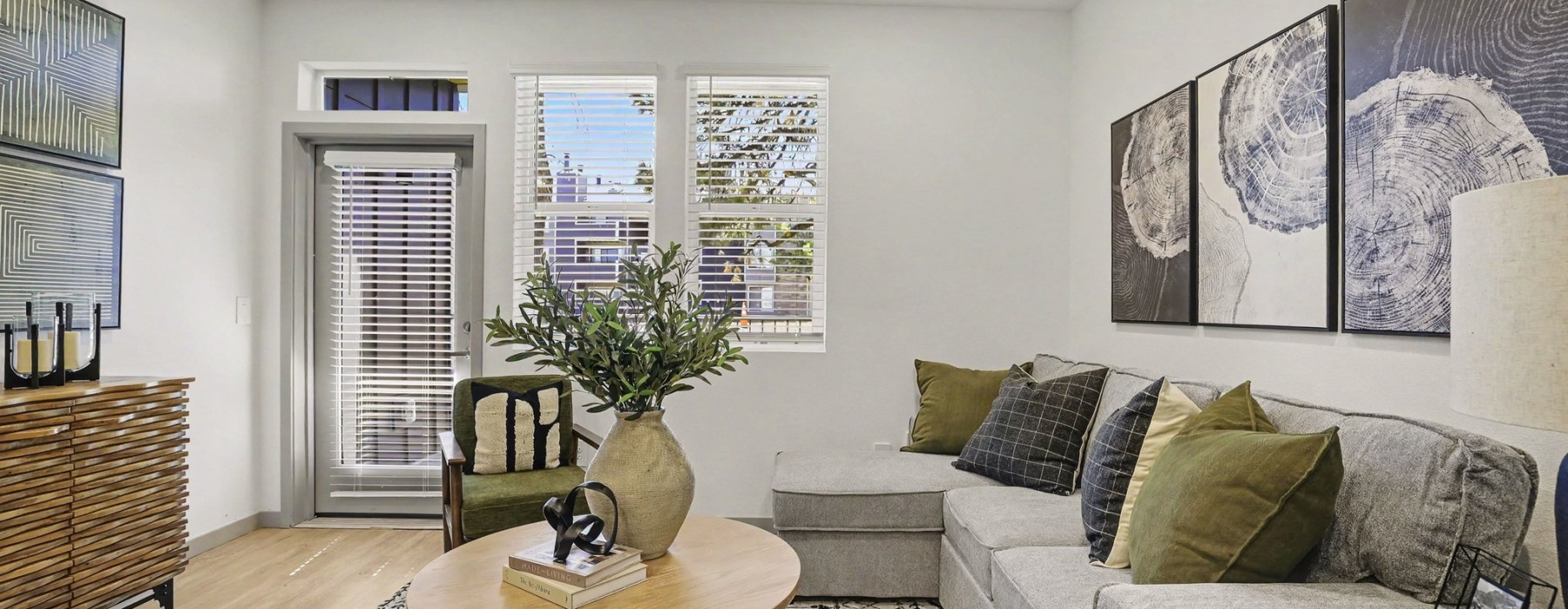 Living room with gray couch and patio access