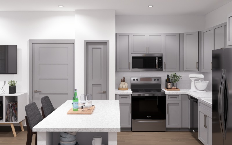 Kitchen with white counters and stainless steel appliances