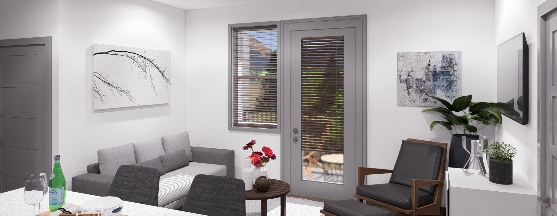Living room with gray couch and patio access