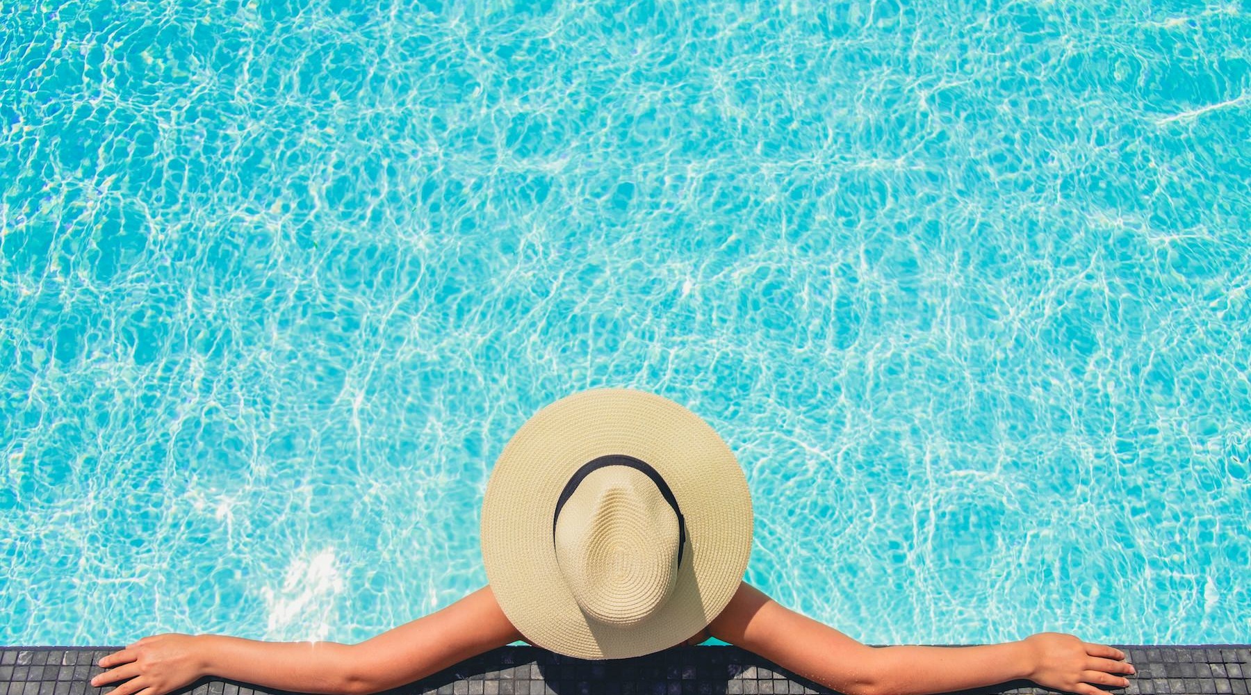 a person lying on the ground with a hat on