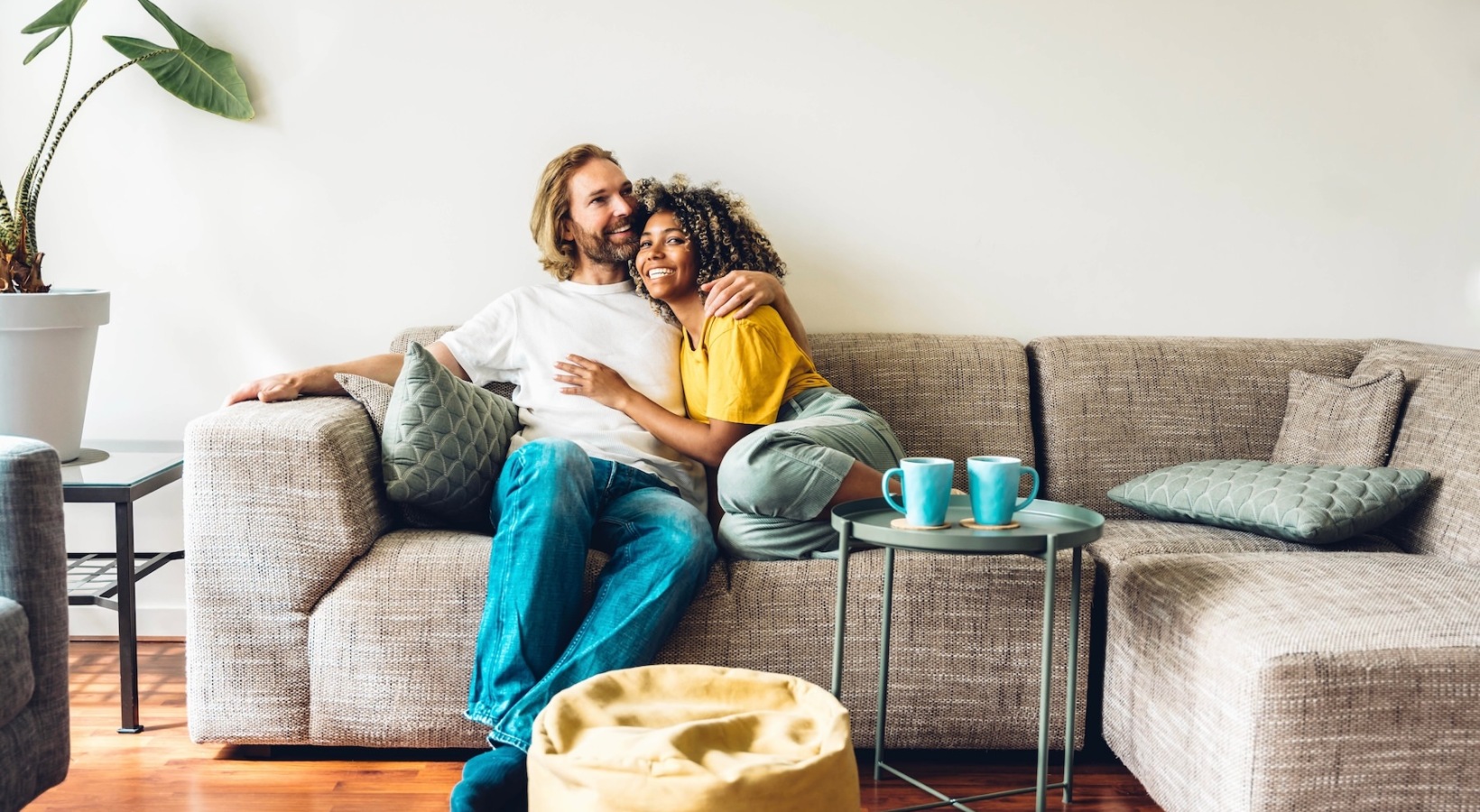 couple embracing on couch