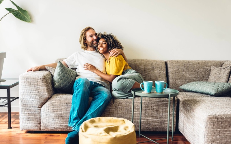 couple embracing on couch