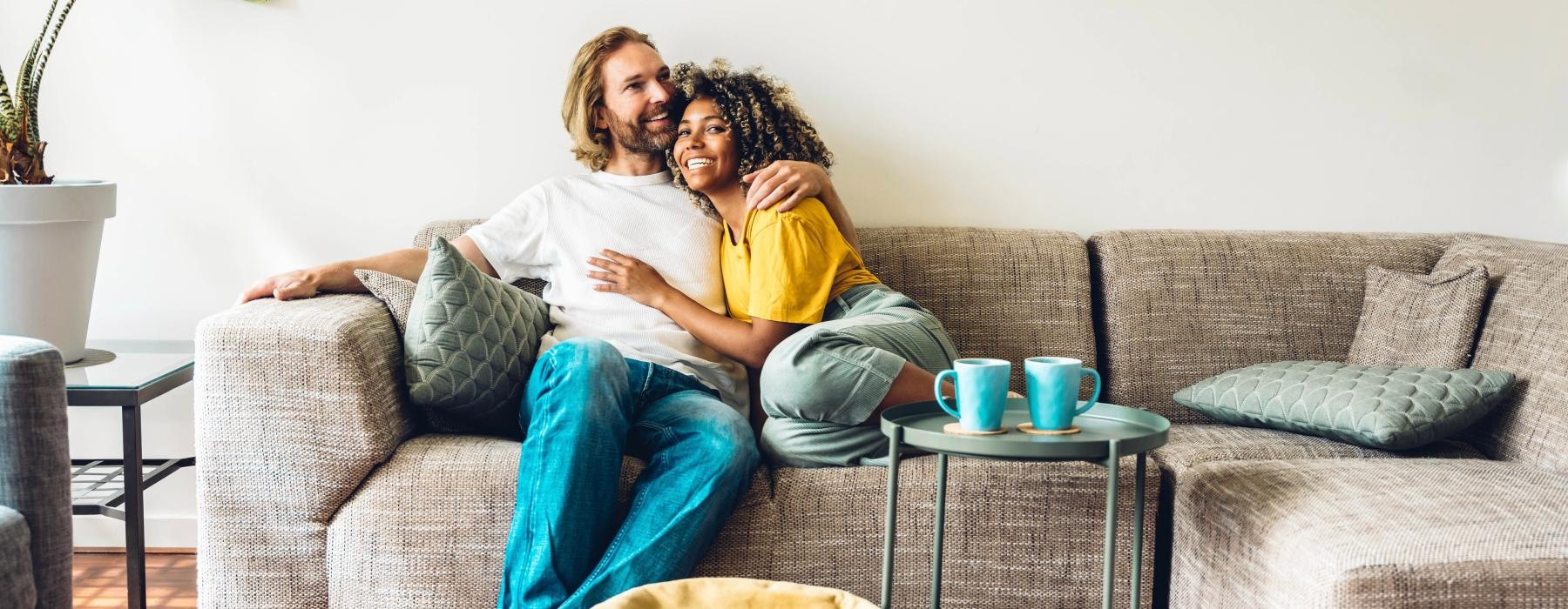 a man and woman sitting on a couch